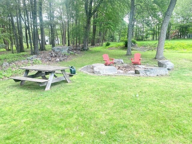 5132 Pocono Park Ln, Swiftwater, PA 18370 - view of grassy yard with an outdoor fire pit