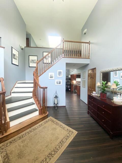 5132 Pocono Park Ln, Swiftwater, PA 18370 - stairway with wood finished floors and a high ceiling