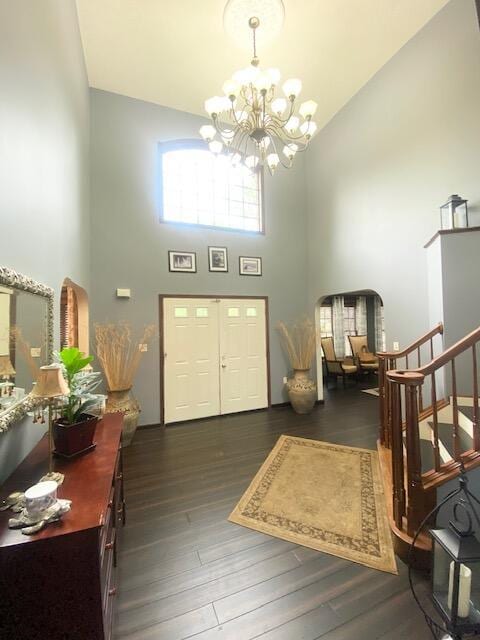 5132 Pocono Park Ln, Swiftwater, PA 18370 - foyer featuring a high ceiling, a chandelier, wood finished floors, stairs, and arched walkways