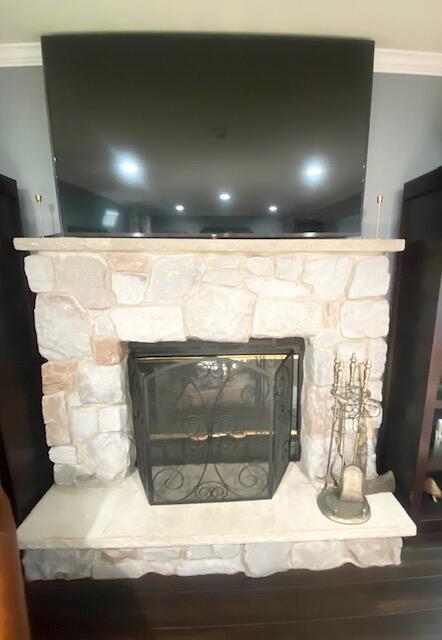 5132 Pocono Park Ln, Swiftwater, PA 18370 - detailed view of crown molding, a fireplace, and wood finished floors
