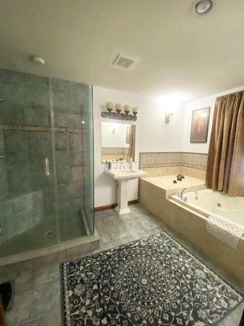5132 Pocono Park Ln, Swiftwater, PA 18370 - bathroom with a garden tub, a stall shower, and tile patterned floors