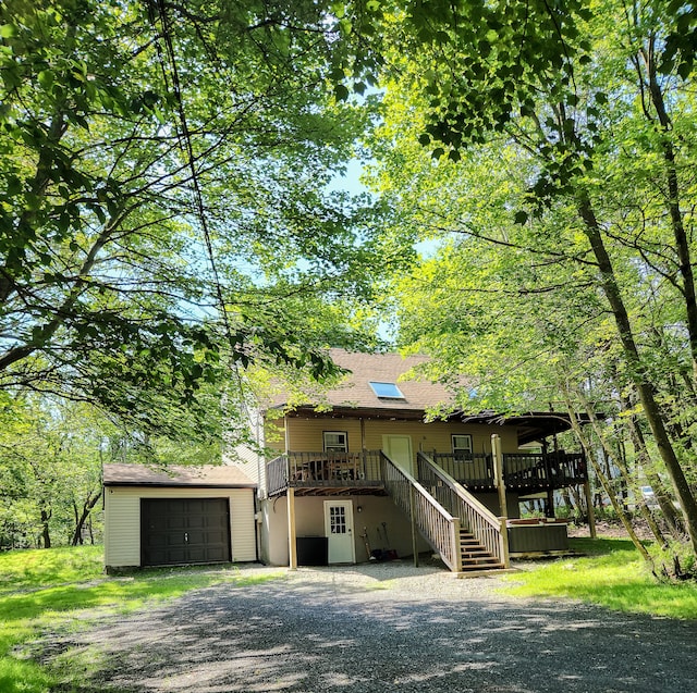 3312 Black Cherry Ct, Long Pond, PA 18334 - view of front facade featuring stairs, a garage, driveway, and a shingled roof