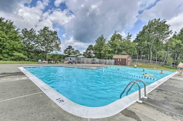 3312 Black Cherry Ct, Long Pond, PA 18334 - pool with an outbuilding, fence, a patio area, and a shed