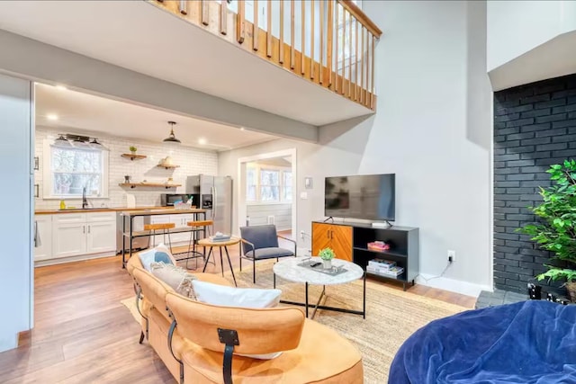3312 Black Cherry Ct, Long Pond, PA 18334 - living room featuring light wood-style floors and baseboards