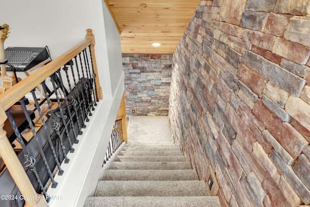 stairway featuring wood ceiling