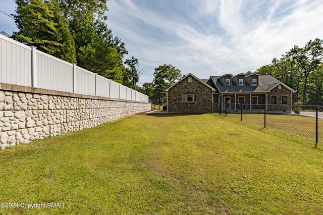 view of yard with a fenced backyard