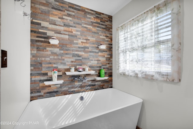 full bathroom featuring a freestanding bath