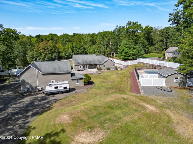 drone / aerial view featuring a view of trees