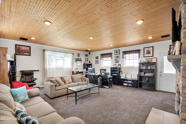 carpeted living room featuring wood ceiling, a fireplace, visible vents, and recessed lighting