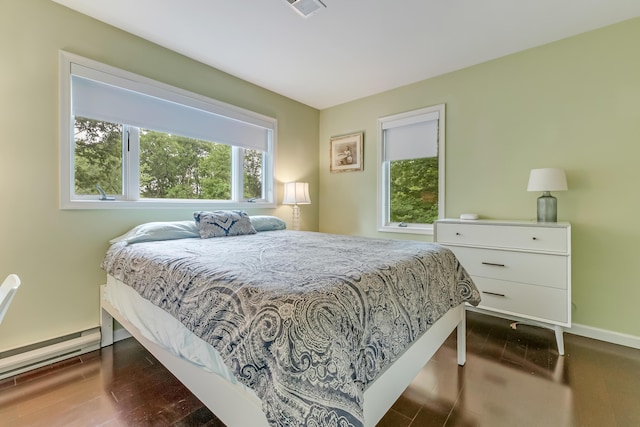 106 Legends Ct, East Stroudsburg, PA 18302 - bedroom with wood finished floors and a baseboard heating unit