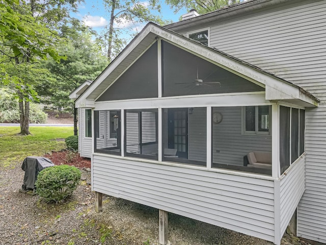 106 Legends Ct, East Stroudsburg, PA 18302 - view of side of property with a sunroom, ceiling fan, and a chimney