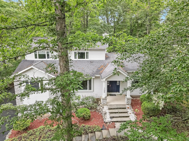 106 Legends Ct, East Stroudsburg, PA 18302 - view of property hidden behind natural elements featuring roof with shingles