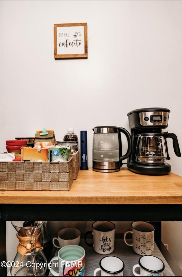 details featuring wooden counters and a kitchen bar