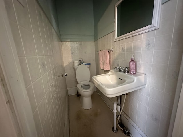 846 Thomas St, Stroudsburg, PA 18360 - half bathroom with tile walls, toilet, and a sink