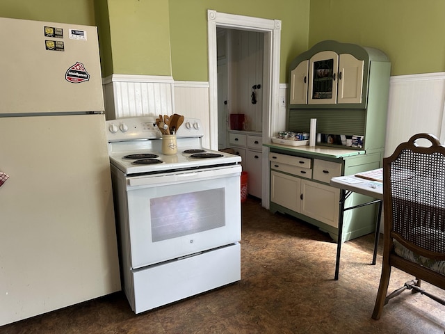846 Thomas St, Stroudsburg, PA 18360 - kitchen with white appliances, wainscoting, and light countertops