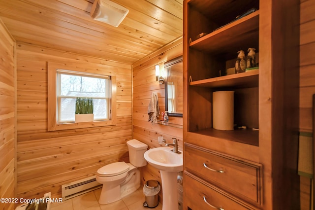 half bathroom featuring a baseboard radiator, tile patterned flooring, toilet, wooden walls, and wood ceiling