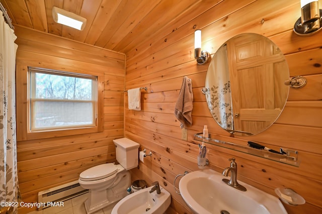 full bath featuring a baseboard radiator, toilet, wood walls, a sink, and wood ceiling