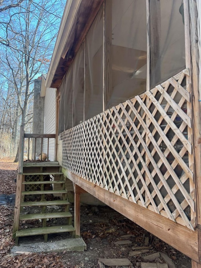 view of side of property featuring a sunroom