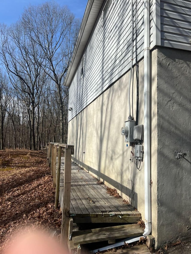 view of side of home with a deck