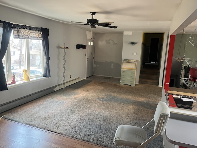 interior space featuring a ceiling fan and a baseboard radiator