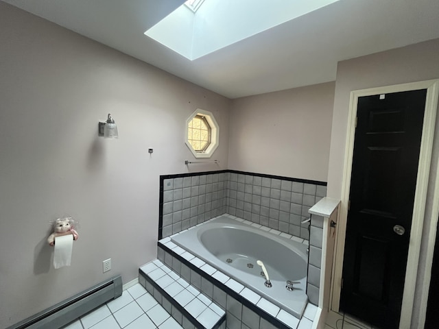 bathroom with tile patterned floors, a baseboard heating unit, a jetted tub, a skylight, and baseboards