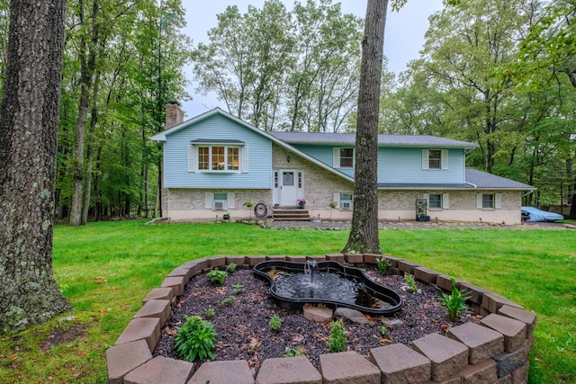 113 Larsen Ln, Cresco, PA 18326 - rear view of property featuring a chimney, a lawn, brick siding, and entry steps
