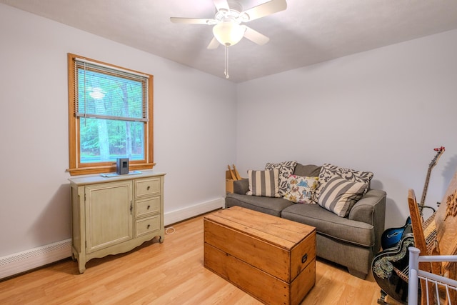 113 Larsen Ln, Cresco, PA 18326 - living area with a baseboard radiator, a ceiling fan, and light wood-style flooring