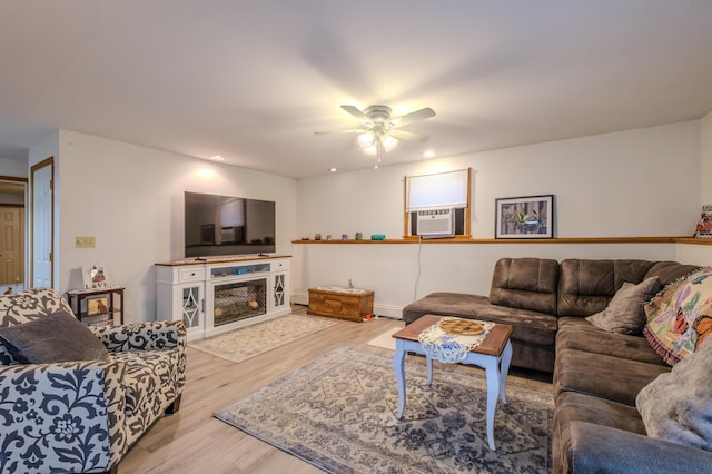 113 Larsen Ln, Cresco, PA 18326 - living room with cooling unit, light wood finished floors, ceiling fan, recessed lighting, and a fireplace