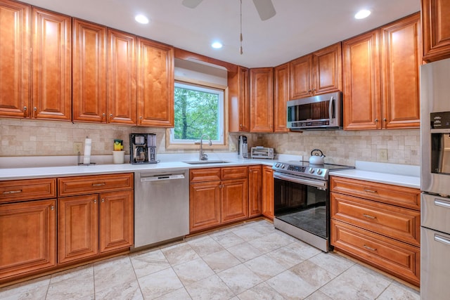 113 Larsen Ln, Cresco, PA 18326 - kitchen with stainless steel appliances, brown cabinets, tasteful backsplash, and recessed lighting