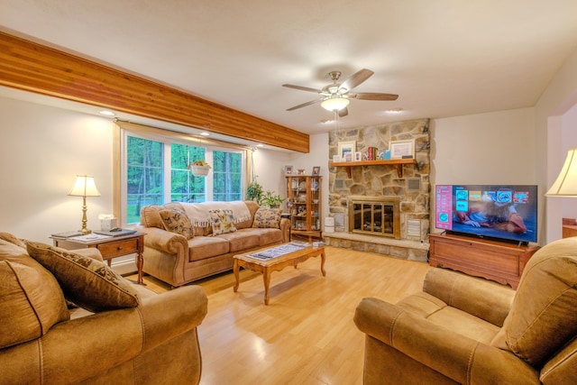 113 Larsen Ln, Cresco, PA 18326 - living room featuring a ceiling fan, wood finished floors, and a fireplace