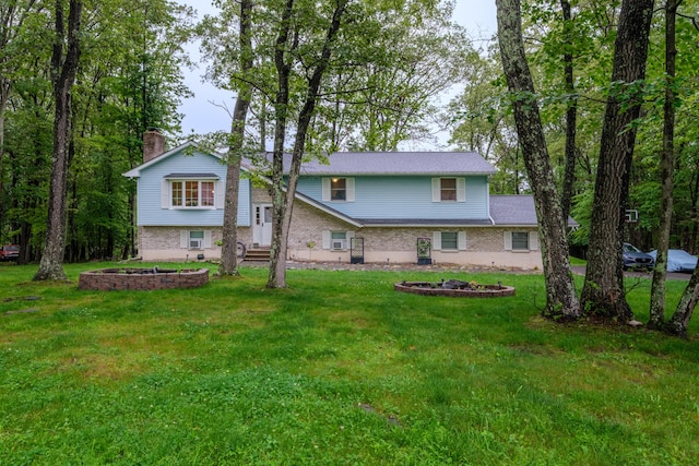 113 Larsen Ln, Cresco, PA 18326 - view of front of home featuring a front yard, brick siding, and a chimney
