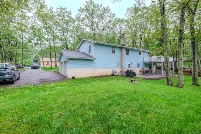 113 Larsen Ln, Cresco, PA 18326 - rear view of house with a chimney, a yard, driveway, and a deck
