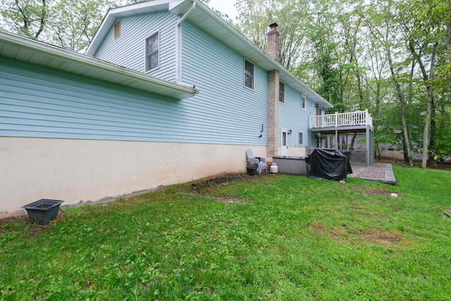 113 Larsen Ln, Cresco, PA 18326 - view of property exterior with a chimney, a lawn, a jacuzzi, and a deck