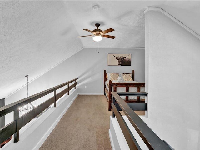 216 Snow Ridge Cir, Lake Harmony, PA 18624 - hall with a textured ceiling, lofted ceiling, carpet floors, and an upstairs landing