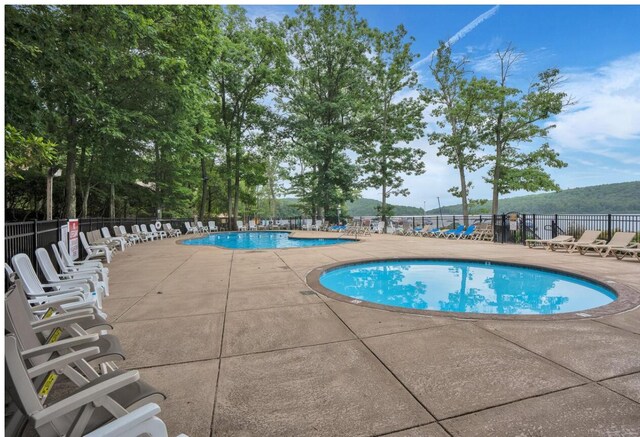 216 Snow Ridge Cir, Lake Harmony, PA 18624 - community pool featuring a patio area
