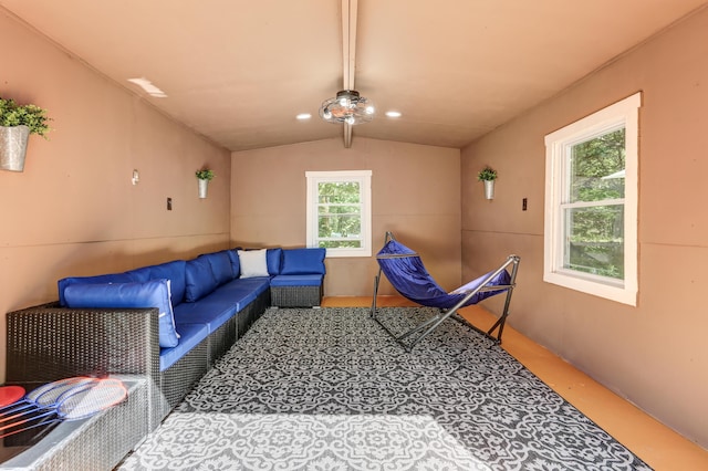 living room featuring recessed lighting and vaulted ceiling