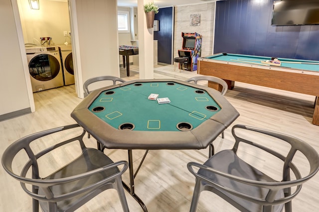 rec room featuring wood finished floors, pool table, and separate washer and dryer