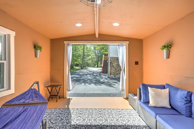 doorway to outside with lofted ceiling, tile patterned flooring, and recessed lighting