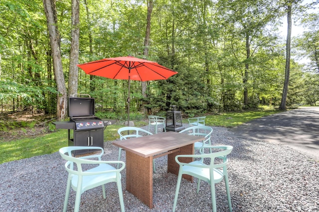 view of patio with a forest view