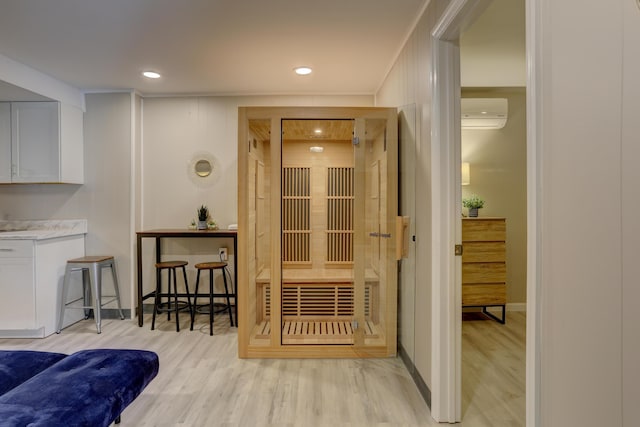 view of sauna featuring baseboards, wood finished floors, and recessed lighting