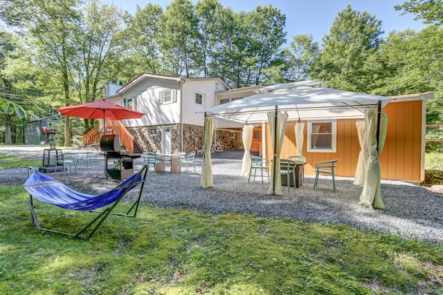 view of play area featuring a patio area and a lawn