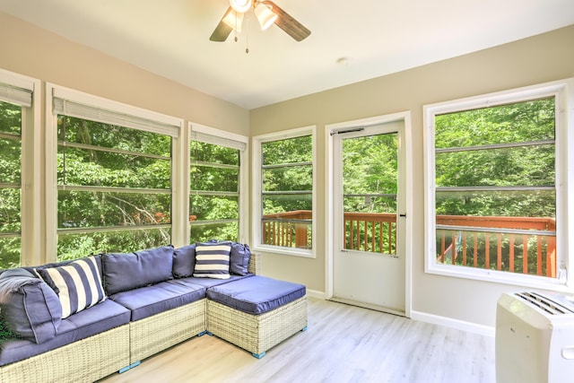 sunroom with a ceiling fan