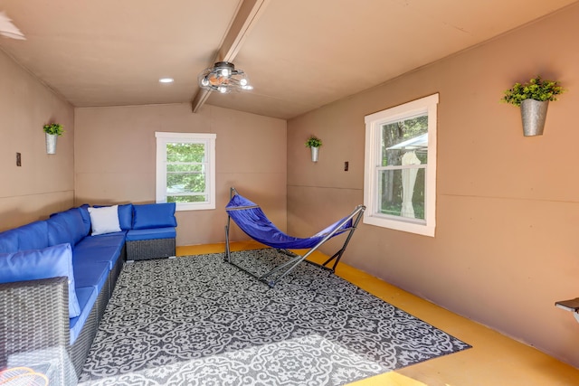 interior space featuring lofted ceiling with beams