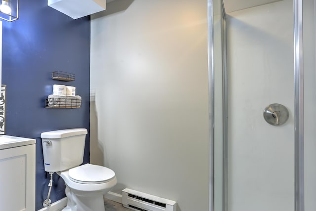 full bath featuring vanity, a baseboard radiator, a shower with door, and toilet