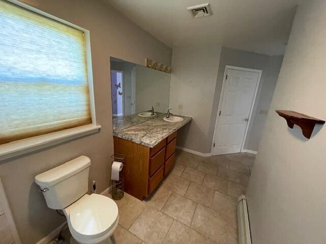 115 Murphy Ln, Kunkletown, PA 18058 - bathroom featuring toilet, a baseboard heating unit, vanity, tile patterned flooring, and baseboards