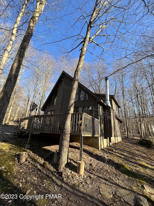 view of side of property with a deck