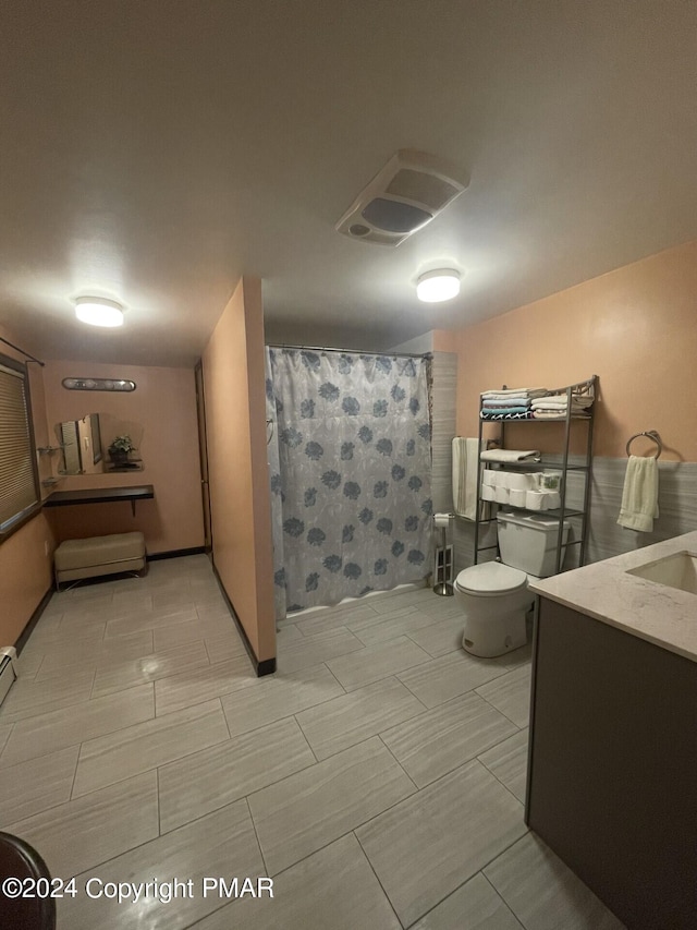 full bathroom with toilet, vanity, and a shower with curtain