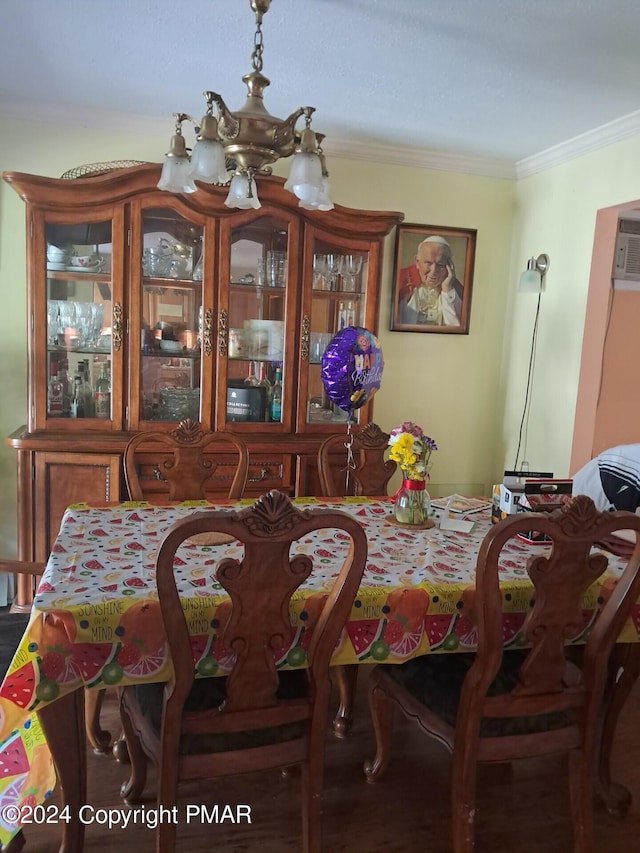 dining room featuring a chandelier and crown molding