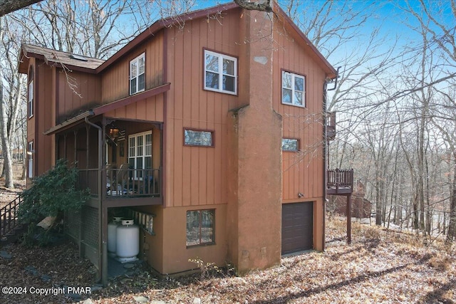 view of side of home featuring a garage