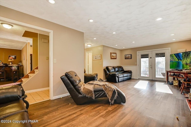 living room featuring recessed lighting, stairway, wood finished floors, and french doors